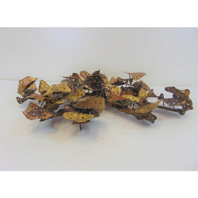 Mid Century Modern brutalist style wall art, made of sheets of pierced cut brass and copper.