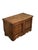 A 19th-century fir wood chest, characterized by a solid structure and a front embellished with panels and decorations that...