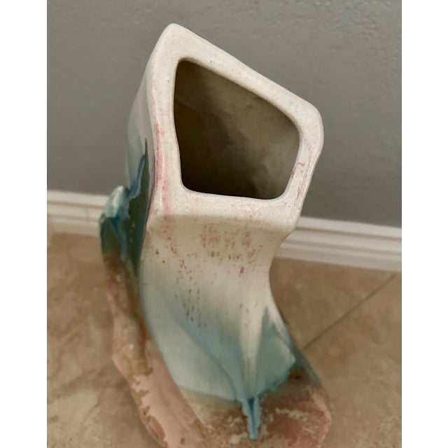 A truly remarkable and collectible piece of art! Large and beautiful multi colored raku vase done in the traditional raku...
