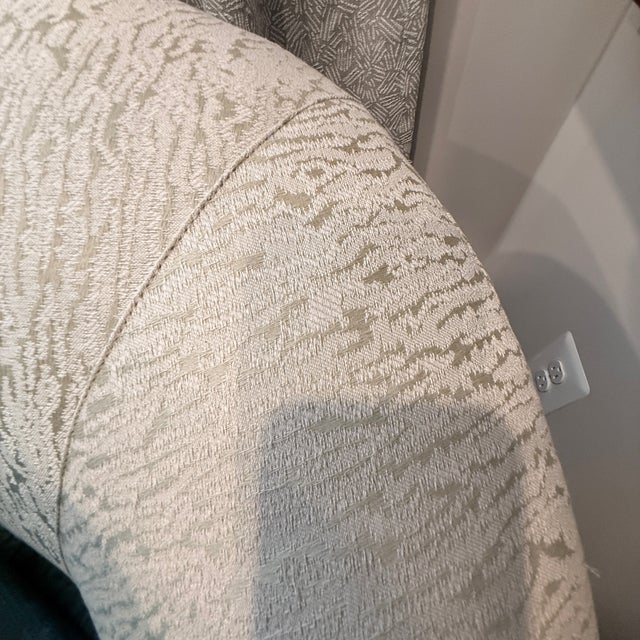 Sanjer Curved Sofa A curvy sofa with box pleats in a subtle green and white fabric. In excellent condition and very well-...