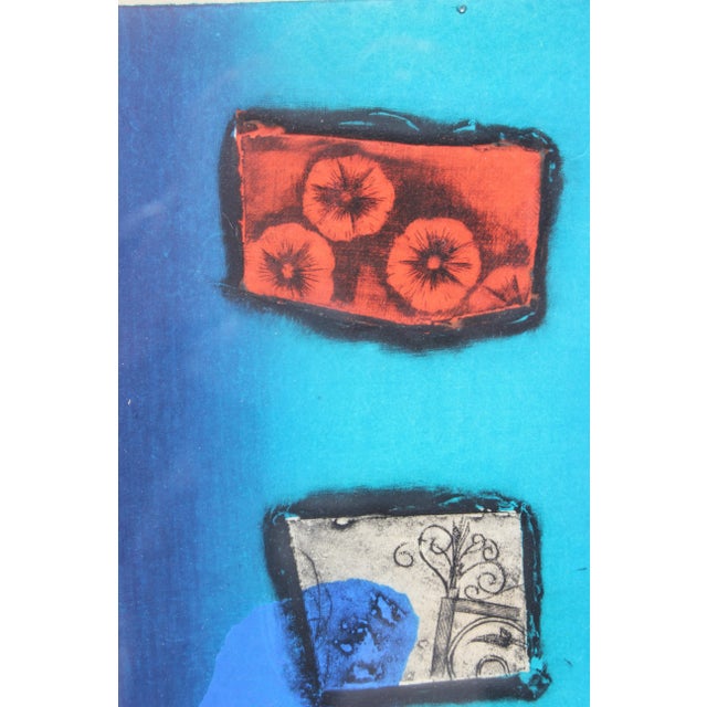 Abstract lithograph of flowers with red, blue and pink tones. Work is signed by the artist and given an edition number....