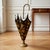 Sculptural vintage Italian-style toleware umbrella stand, likely dating circa 1950s. Fashioned as an open umbrella with...