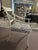 Pair of Baker side dining chairs with sculptural wood frames, upholstered in a black and white fabric. Minor surface...
