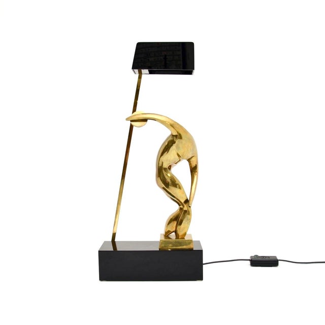 An incredibly beautiful and stylish vintage Italian sculptural bronze table lamp by Maxime Delo. this was made in Italy,...
