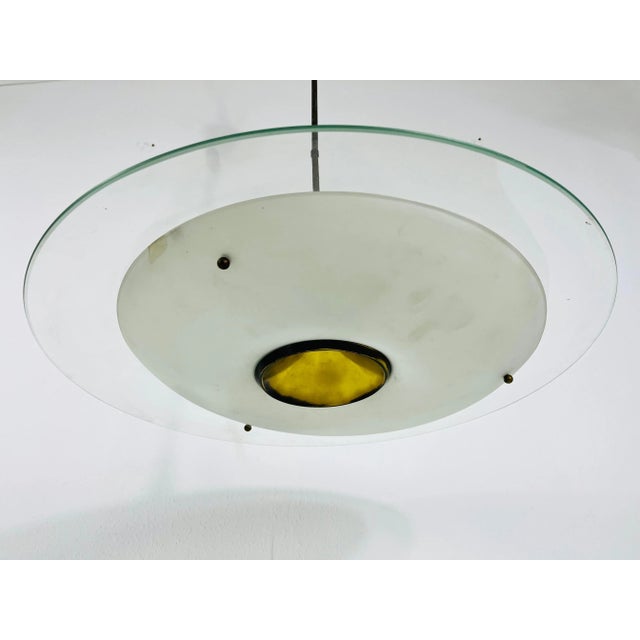 A sputnik chandelier made in italy in the 1950s. It is fascinating with its unique saucer shape and wonderful glass...