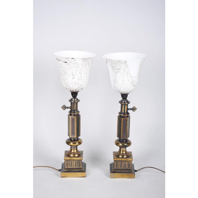 This pair of table lamps is an exclusive example of 1950s french design, carrying a strong legacy of peak art deco. The...