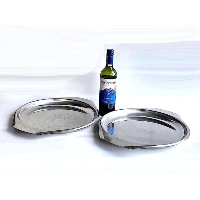 Offered is a set of 2 large stainless steel trays made by Kalmar in Denmark in the 1960s. They are lovely eye shaped ovals...