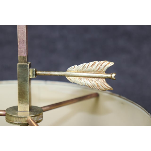 Timeless and distinctly French, this Directoire style gilt metal and tole bouillotte lamp is a beautiful example of mid-...