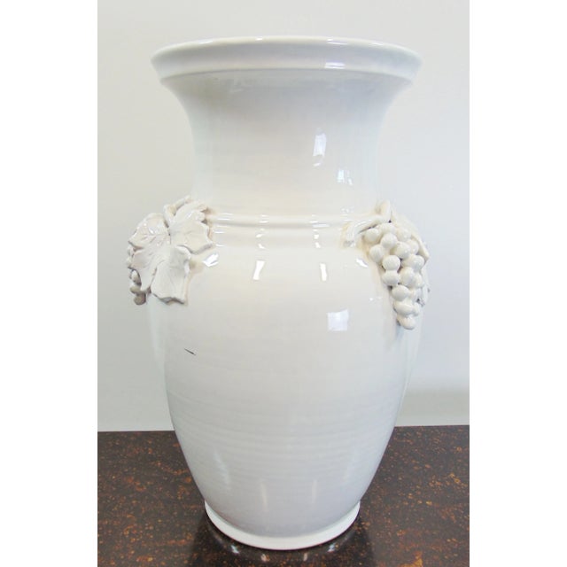 Italian Terracotta vase, white glaze finish, applied grape and leaf pattern