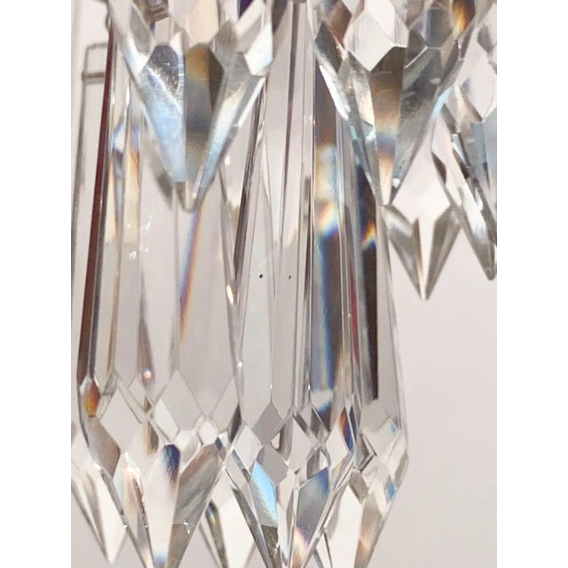 Italian layered chandelier with brass rim, octagon chain and 30% leaded crystal plug drops. It has 1 Edison base socket...