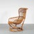 A stunning rattan lounge chair, manufactured in Italy in the 1960s. This eye-catching piece is completely made of the...