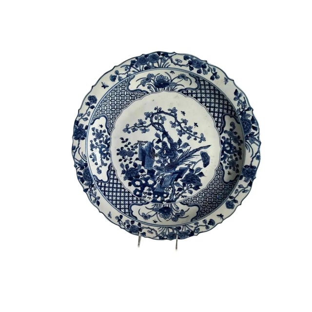 A pair of very pretty 21st century blue and white Chinese chargers with a floral design and scalloped edge.