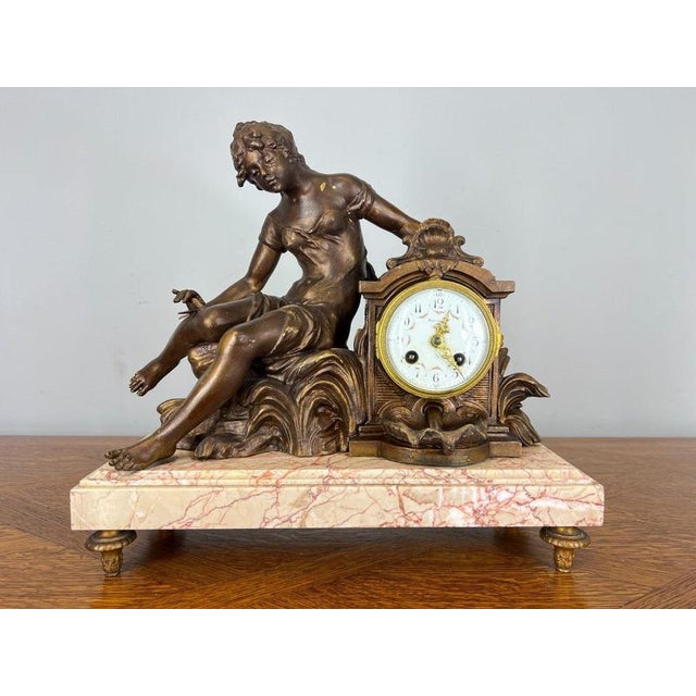 This elegant Antique French Art Nouveau mantel clock garniture dates from the Belle Époque period and features a...