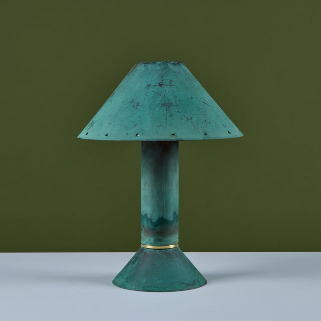 Postmodern table lamp by Los Angeles lighting designer Ron Rezek, c.1980s. The lamp features a verdigris copper frame and...
