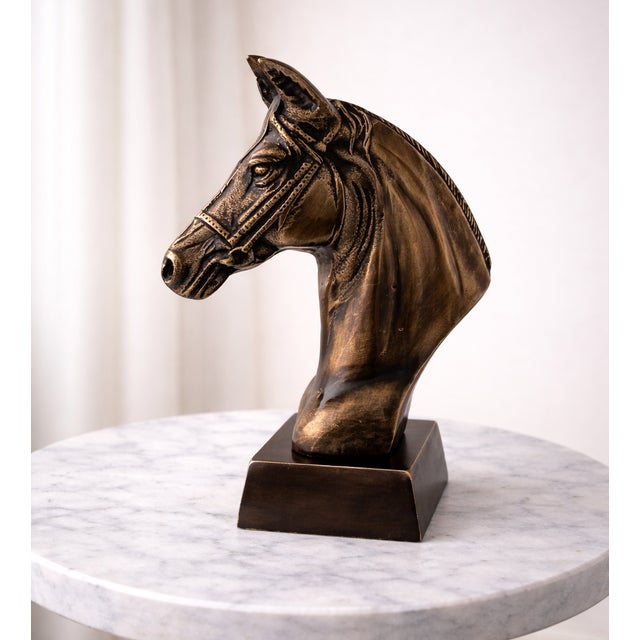 Bring timeless equestrian character to your interior with this handcrafted metal horse bust, finished in a warm antique...