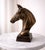 Bring timeless equestrian character to your interior with this handcrafted metal horse bust, finished in a warm antique...