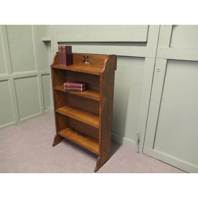 Arts & Crafts Bookcase with Carved Gallery This charming little shelf unit has a carved gallery to the back and 4 open...