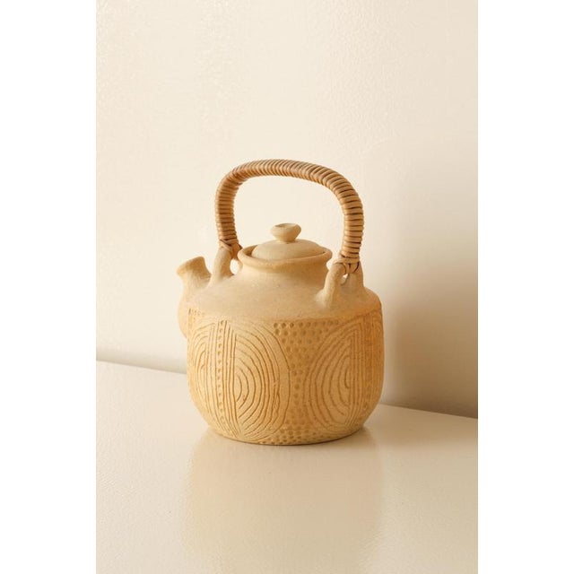 This elegant teapot, designed by Signe Persson-Melin, is a fine example of Scandinavian craftsmanship and timeless design....