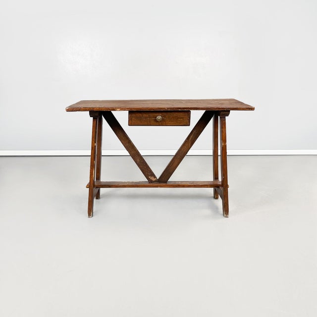 Rectangular wooden fratino table. The supporting structure of the top is made up of several wooden beams. In the center it...