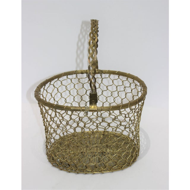 This stylish and chic woven brass basket will make a perfect catchall for magazines, or perhaps for the dogs toys.