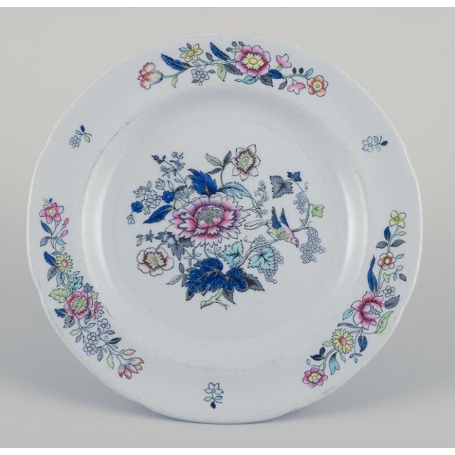 Copeland/Spode, England. Nine plates in faience. Decorated with floral and bird motifs. Approximately from the 1930s. In...