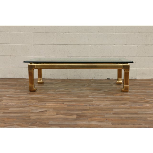 A striking vintage Hollywood Regency coffee table by Mastercraft, (no maker’s mark) circa 1970s. Featuring a beautifully...