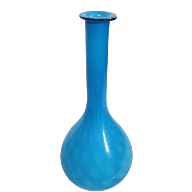 Attractive elongated art glass vase, having a bulbous baby blue body, with a quilted pattern cased glass surface. Made in...