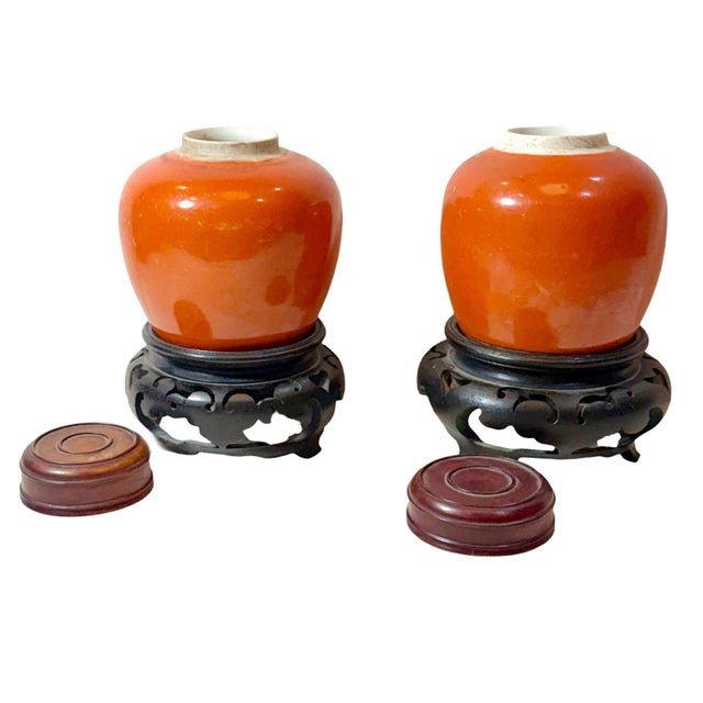 A striking pair of Chinese ginger jars dating to the 19th century, presented with later associated lids and stands from...