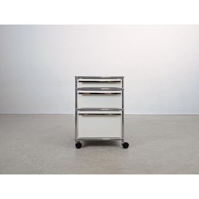 We are offering a total of seven beautiful white USM Haller mobile pedestals for sale. These office cabinets fit perfectly...