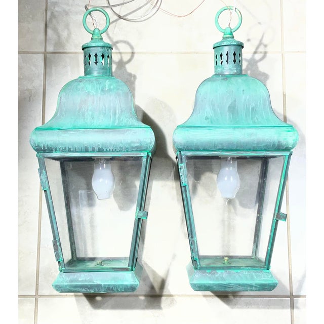 add a timeless historical touch to your house with this spectacular matching pair of solid brass hanging lanterns....