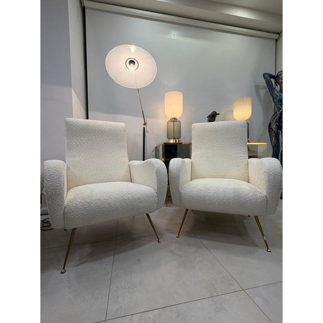 Pair of 1960s armchairs designed by Marco Zanuso with stain-resistant bouclé, perfectly restored. This piece is designed...