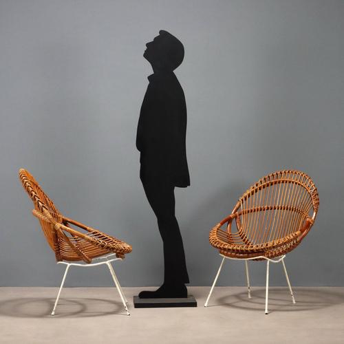 Pair of vintage armchairs with white enameled metal legs and wicker and bamboo seats. This piece is attributed to the...