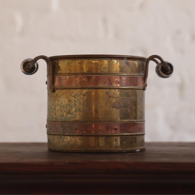 A handsome 20th Century Belgian Brass &amp; Copper Bucket, crafted with alternating bands of warm brass and copper that...