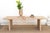Some tables lean on ornament to make their case; this one relies entirely on proportion. Built from reclaimed wood with a...