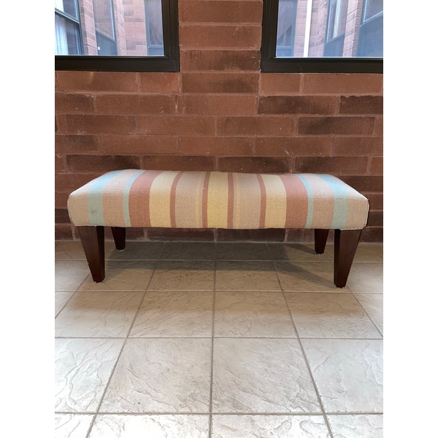 This mid-century circa late 1960s bench is upholstered in a beautifully textured heavy wool-blend woven fabric in a warm...