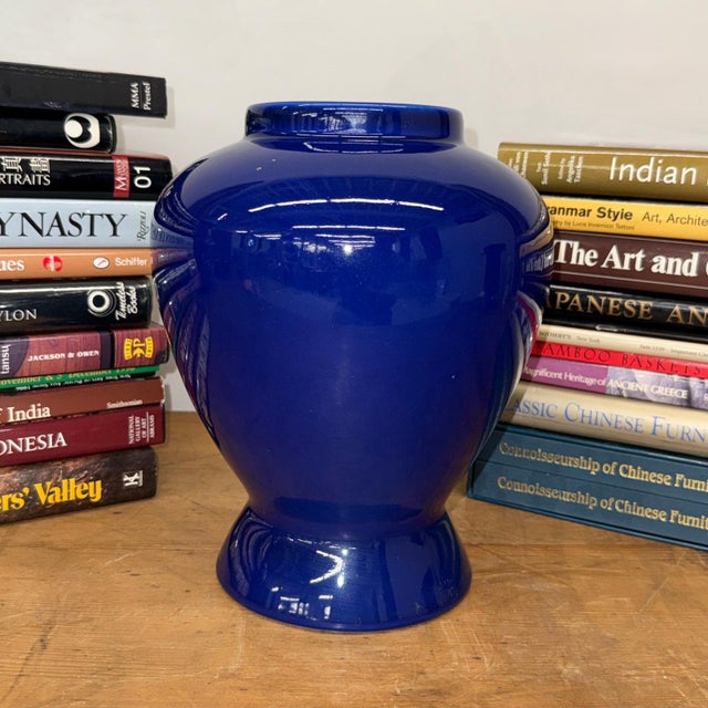 "About This Piece About This Piece Bold, luminous, and unforgettable, this cobalt blue vase commands attention with its...