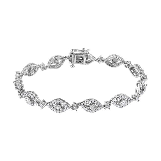 Let yourself be dazzled by this genuine .925 sterling silver link bracelet that showcases 2 1/2ct TDW of diamonds. 198...