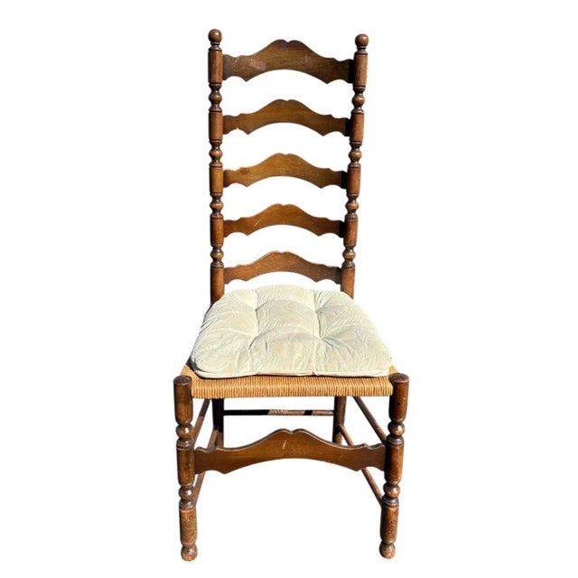 This beautiful 19th-century English ladder back chair embodies rustic elegance and timeless craftsmanship. The tall back...
