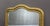 Large original gilt stucco mirror, top of the mirror in a gendarme's hat shape, Napoleon III period, overall in good...