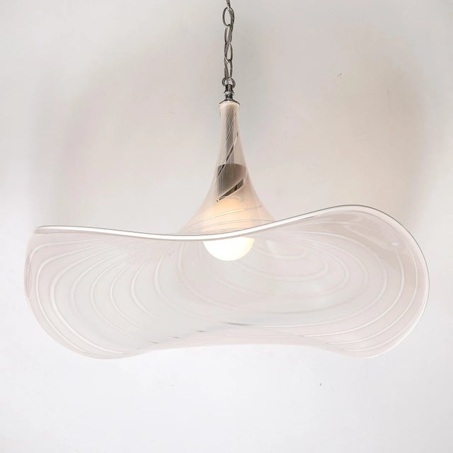 This stunning mid-century modernist pendant chandelier showcases the exceptional artistry of hand-blown Murano glass....