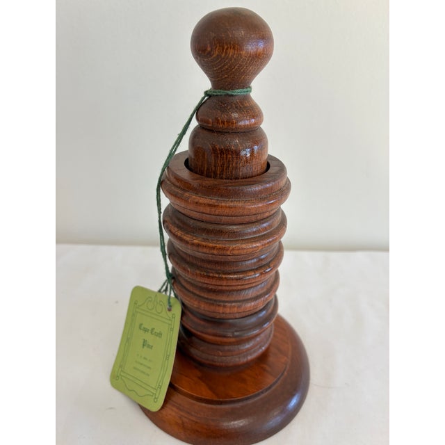 This vintage turned wood napkin ring stand from Cape Craft Pine of Elizabethtown, North Carolina, is one of our vintage...