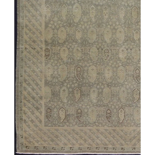 Measures: 6'8'' x 9'0'' Stylized paisley motifs are featured in a repeating pattern on this Sivas wool rug. A blend of...