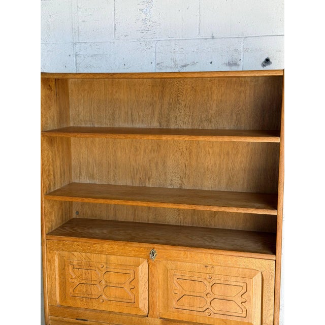 Beautiful vintage Danish secretary cabinet in style of Henning Kjærnulf and crafted in oak. This elegant Scandinavian...