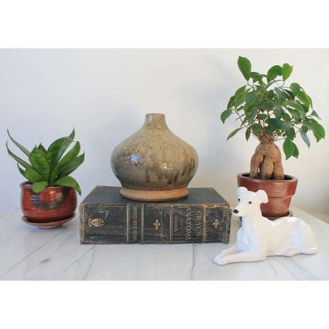 Vintage studio art glazed pottery vase. Signed by artist on bottom. One small chip. Pictured.