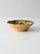 This vintage mid-century Mexican pottery bowl features a shallow, organically shaped form decorated with hand-painted...