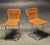 Pair of "Calla" dining chairs by Antonio Ari Colombo for Arflex, 1970s. Cognac saddle leather seat and back, white cotton...