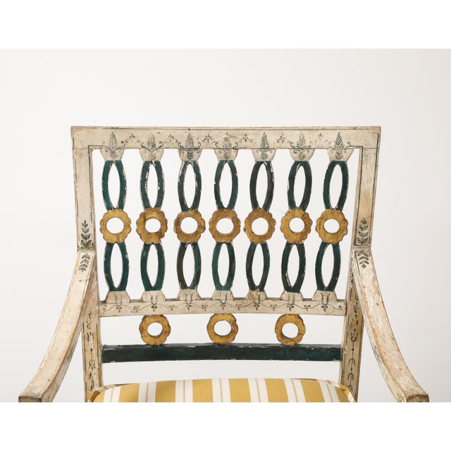 Elegant pair of 18th-century Swedish side chairs, crafted in painted wood with original polychrome finish. The design...