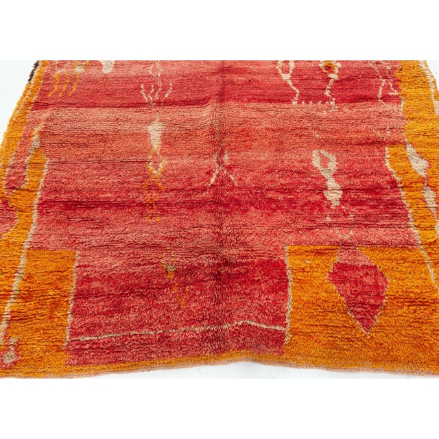 Vintage Tribal Moroccan Red Orange Wool Rug Size: 5'4" × 5'10" (162 × 177 cm) This captivating vintage Moroccan rug,...