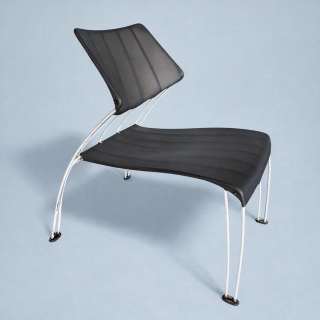 A striking and sculptural 1990s ikea chair designed by monika mulder, showcasing a bold “space age” aesthetic with clean,...