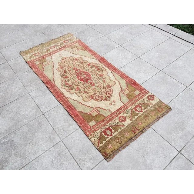 A Turkish handmade vintage Anatolian Oushak rug. We collect old vintage antique rugs from Anatolia, which is the eastern...